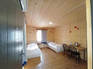 Katil atau katil-katil dalam bilik di Teo's Cottages