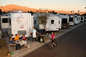 a group of people in front of a row of rvs at Arizona Charlie's Boulder in Las Vegas