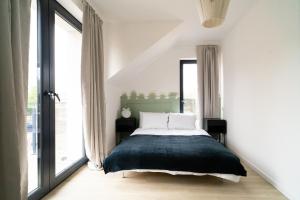 Postel nebo postele na pokoji v ubytování Nad jeziorem Nagus w Toruniu