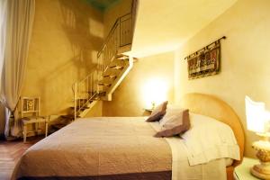 Posteľ alebo postele v izbe v ubytovaní Italian Experience-Suite Medici