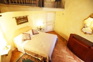 Posteľ alebo postele v izbe v ubytovaní Italian Experience-Suite Medici