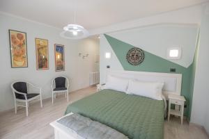 En eller flere senger på et rom på B&B Le Scalette B&B San Marco