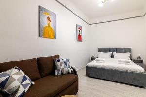 Кровать или кровати в номере Avangard Shevchenko Avenue 11 Apart