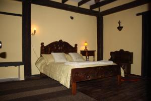 Tempat tidur dalam kamar di Hacienda La Merced Baja