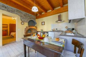 a kitchen with a counter with a sink and a stove at Casa Terry in Madonna del Sasso