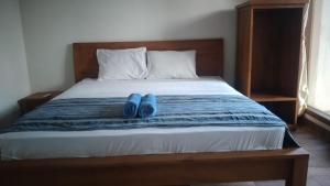 Postel nebo postele na pokoji v ubytování Kutabay Homestay