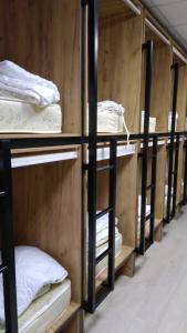 a row of bunk beds in a room at Hostel Rus Aviator in Moscow