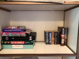 a group of books sitting on a shelf at Kingston Pines in Kingston 