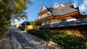 a house on the side of a road at Delta House in Zakopane