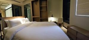Voodi või voodid majutusasutuse Unijoy Cityinn OCT Loft Shenzhen有集城市客栈创意园店 toas