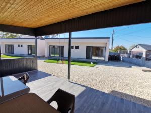 a view of a house from the outside of a patio at Casutele Amaliei in Corbu