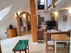 a living room with a ping pong table at Dolac Guesthouse in Zagreb