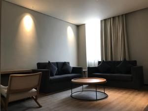 Istumisnurk majutusasutuses Unijoy Cityinn OCT Loft Shenzhen有集城市客栈创意园店