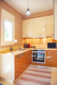 Kuchyň nebo kuchyňský kout v ubytování S.V. Luxury Apartment