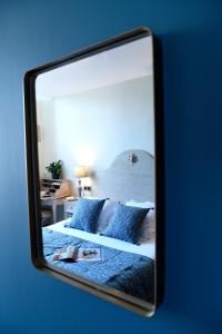 Voodi või voodid majutusasutuse The Originals Boutique, Hôtel du Parc, Cavaillon toas
