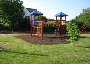 a playground with a play equipment in a yard at Stierstall-Suite Pension Wahlenau in Wahlenau