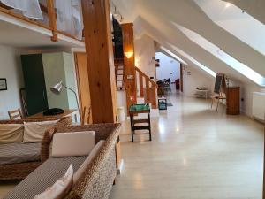 a living room with couches and stairs in a building at Dolac Guesthouse in Zagreb