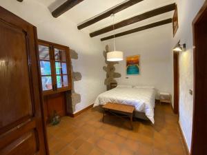 Cama o camas de una habitación en Casa Rural El Drago