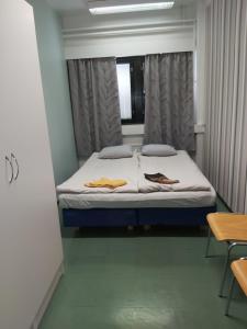 Un pat sau paturi într-o cameră la Ruskalinna Apartments