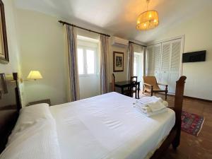 Łóżko lub łóżka w pokoju w obiekcie Villa Casa Alta