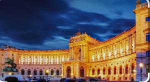 a building lit up at night with a cloudy sky at Vienna Center,private zimmer, ! in Vienna
