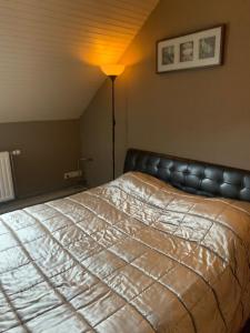 Postel nebo postele na pokoji v ubytování Ruim appartement in oude bakkerij