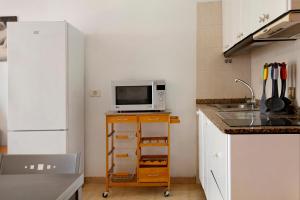 A kitchen or kitchenette at Balcón de Amadores 1