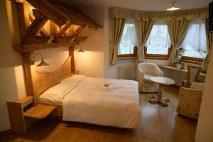 Tempat tidur dalam kamar di Garnì Costa Verde