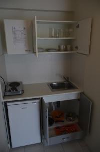 Cuisine ou kitchenette dans l'établissement Klery Studios