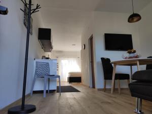 A television and/or entertainment centre at Apartment Hagen