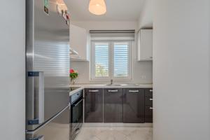 Kuchyň nebo kuchyňský kout v ubytování Apartmani Zaja