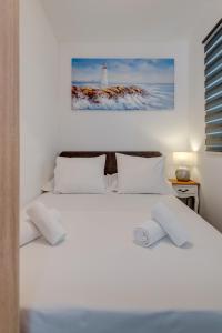 Postel nebo postele na pokoji v ubytování Apartmani Zaja
