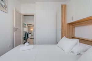 Postel nebo postele na pokoji v ubytování Apartmani Zaja