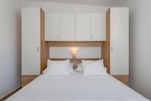 Postel nebo postele na pokoji v ubytování Apartmani Zaja