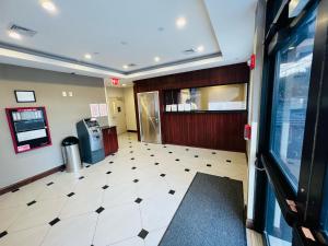 a lobby of a fast food restaurant with a check in counter at Rockaway Hotel in Brooklyn