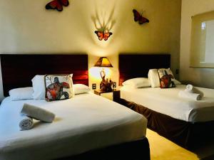 Postel nebo postele na pokoji v ubytování Villas Palmar Holbox