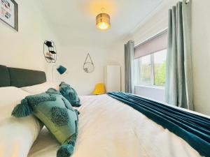 a bedroom with a bed and a window at Linburn House in Glasgow