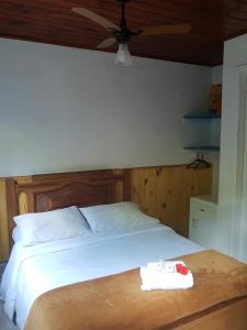 Cama ou camas em um quarto em Pousada Casa Azul