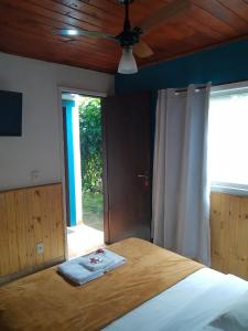 Cama ou camas em um quarto em Pousada Casa Azul