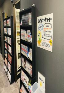 a video game store with shelves full of video games at Henn na Hotel Tokyo Haneda in Tokyo