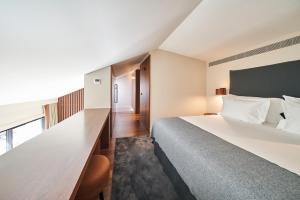 Postel nebo postele na pokoji v ubytování PortoBay Flores