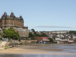 a view of a beach with buildings and a city at Sally's Berth in Scarborough