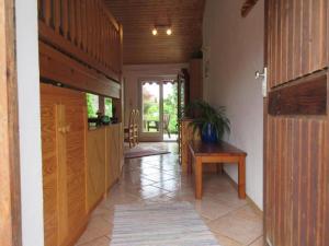 a hallway of a house with a table and a door at Steffl Martina in Grassau