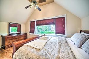 a bedroom with a bed and a dresser and a window at Pet-Friendly Latham Retreat about 7 Mi to Albany! in Latham