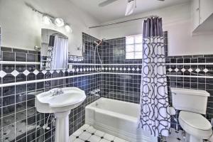 a bathroom with a sink and a toilet and a tub at Tranquil Tucson Home with Yard - Walk to U of A in Tucson +21 photos