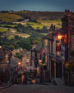 a street in a town with a flag on it at Haworth Hideaway in Haworth