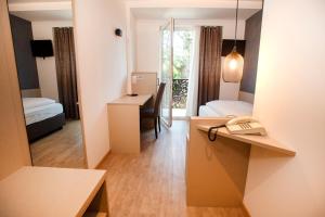 Postel nebo postele na pokoji v ubytování Hotel Chrys