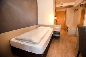 Postel nebo postele na pokoji v ubytování Hotel Chrys