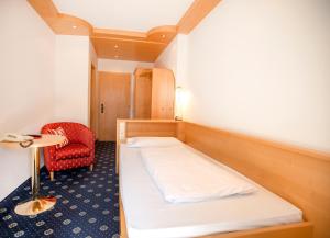Postel nebo postele na pokoji v ubytování Hotel Chrys