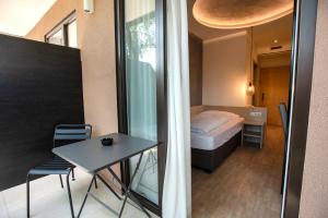 Postel nebo postele na pokoji v ubytování Hotel Chrys